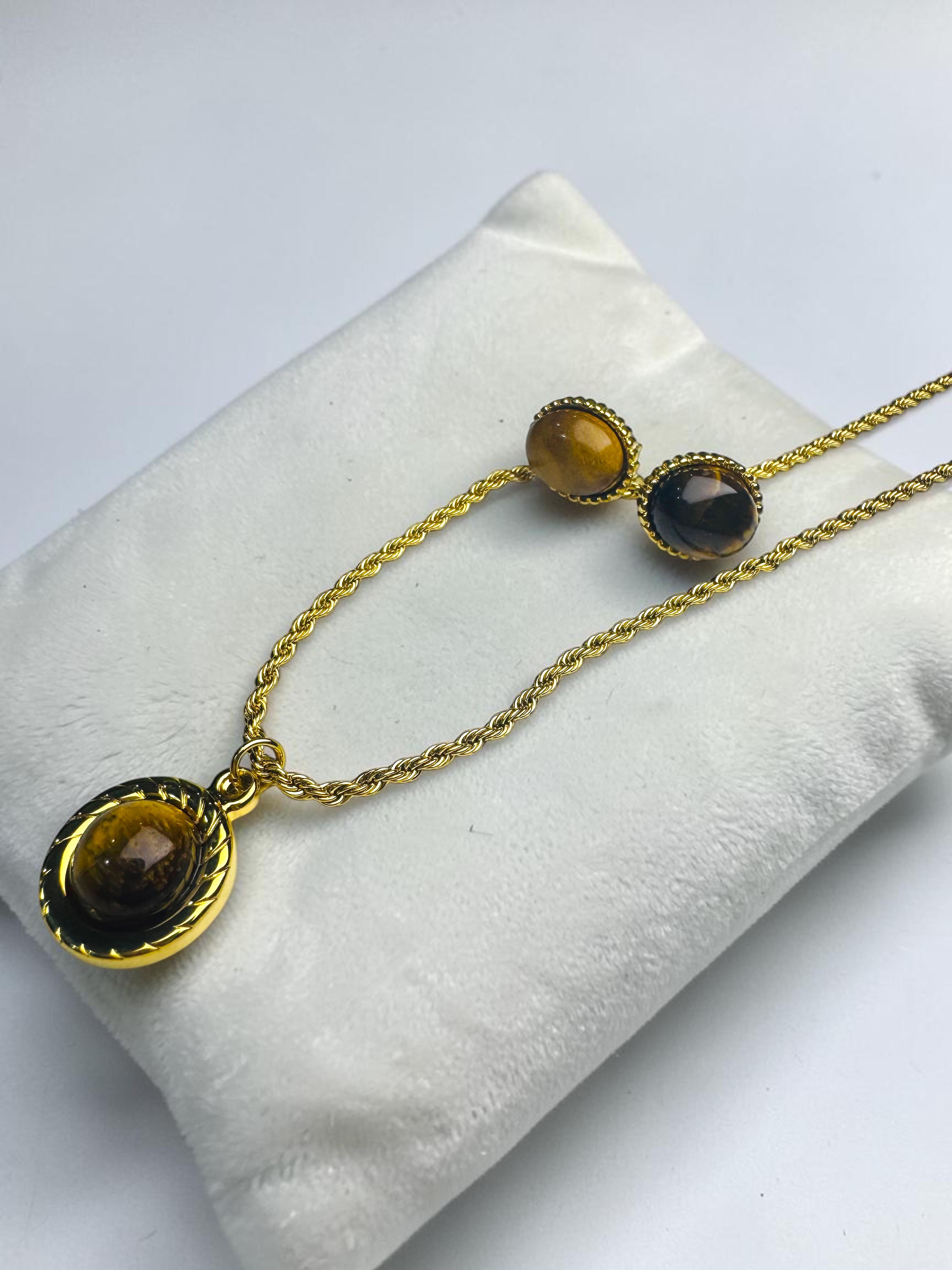 set aretes y cadena con dijen.